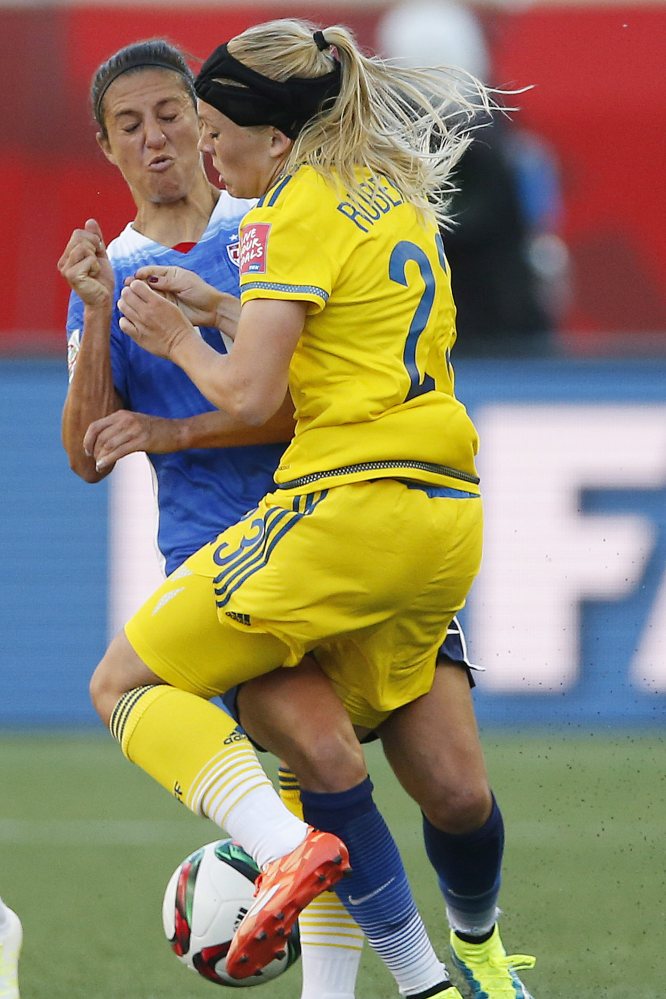 The United States’ Carli Lloyd (10) and Sweden’s Elin Rubensson collide during the first half of Friday’s Women’s World Cup match in Winnipeg, Manitoba. The teams finished in a scoreless tie.
