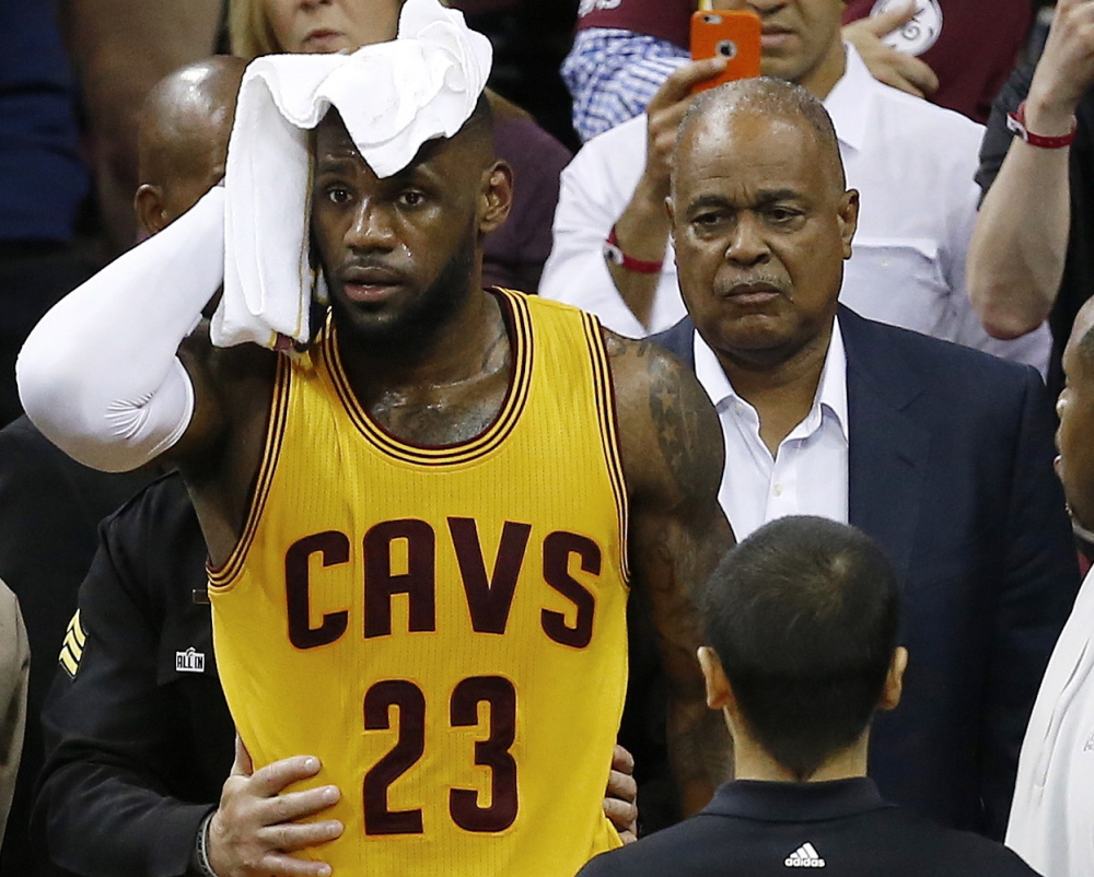 Cleveland’s LeBron James needed a towel for his head Thursday night after he sustained a cut from colliding with a TV camera. James was not evaluated for a concussion.