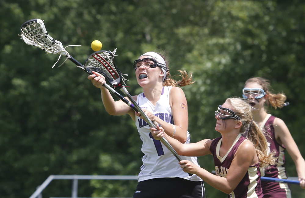 Isabelle Ury of Marshwood, left, competes for a loose ball with Julianna Grondin of Thornton Academy during the second half of Marshwood’s 4-2 victory in a Western Class A girls’ lacrosse semifinal.