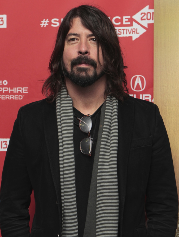 Dave Grohl, the Foo Fighters’ frontman, fell off a stage in Sweden and fractured a leg, the band says.