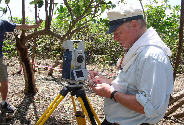 Ric Gillespie, co-founder of The International Group for Historic Aircraft Recovery, in photo at left, surveys an area during an expedition to the South Pacific island of Nikumaroro in Kiribati. Some question that his finds are tied to Amelia Earhart.