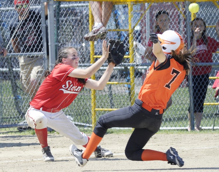 Biddeford’s Erin Martin slides safely into third as Scarborough’s Maggie Murphy waits for the throw during the Red Storm’s 6-5 win Saturday in Scarborough.
