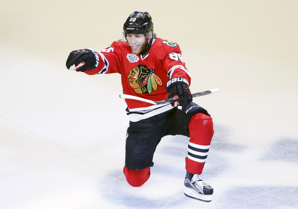 Chicago’s Patrick Kane celebrates after scoring in the third period Monday night to give the Blackhawks a 2-0 lead.