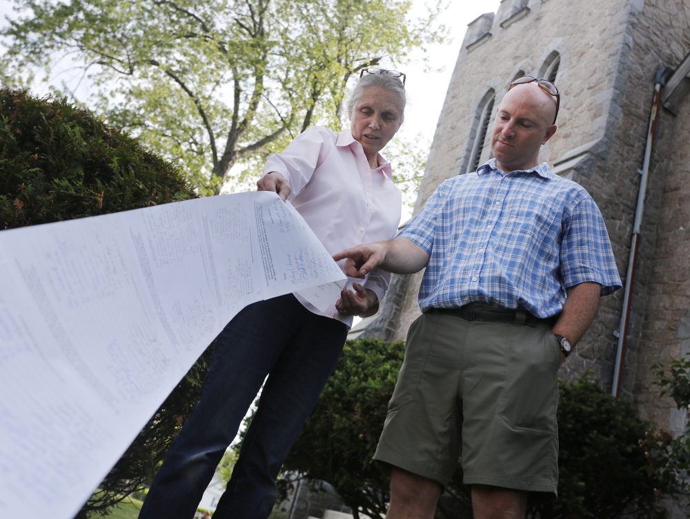 Bobbi Cope, left, and John Thibodeau say they have collected over 450 signatures opposing the proposed zoning change in Deering Center that would allow the site of St. Joseph's Convent to be converted into 88 units of senior housing and the fields behind the convent to be used for four or five new buildings.
Derek Davis/Staff Photographer