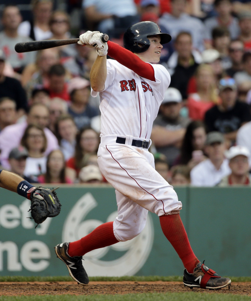Brock Holt hits his triple in the eighth inning Tuesday, becoming the first Red Sox player to hit for the cycle in 19 years. The Red Sox went on to a much-needed win.
