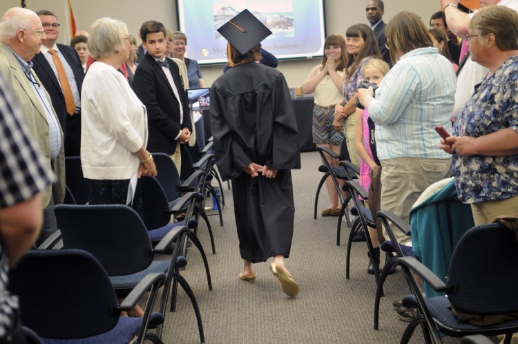 Shaynah-Cherokeigh Seames of Bethel walks Tuesday in
the graduation ceremony for Maine Connections Academy, the state’s first virtual public charter school, in Augusta.