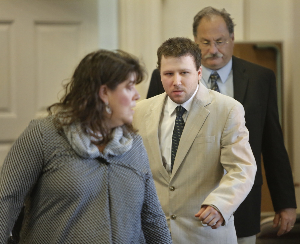 Derek Poulin follows his attorney, Amy Fairfield, into York County Superior Court in Alfred for the opening of his murder trial on Thursday. Poulin is accused of killing his grandmother, Patricia Noel, and setting her Old Orchard Beach home on fire in 2012.