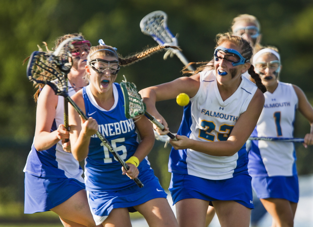 Kennebunk’s Hailey Fecko and Falmouth’s Elizabeth Goodrich battle for a loose ball during Wednesday’s Western Class B girls’ lacrosse final at Falmouth. Kennebunk won, 9-7.