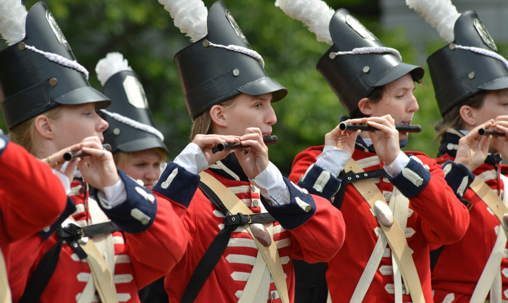 Members of a fife and drum corps play Wednesday in Boston. A time capsule, containing artifacts including coins and a silver plaque, was originally placed at the Statehouse by Gov. Samuel Adams and Paul Revere in 1795.