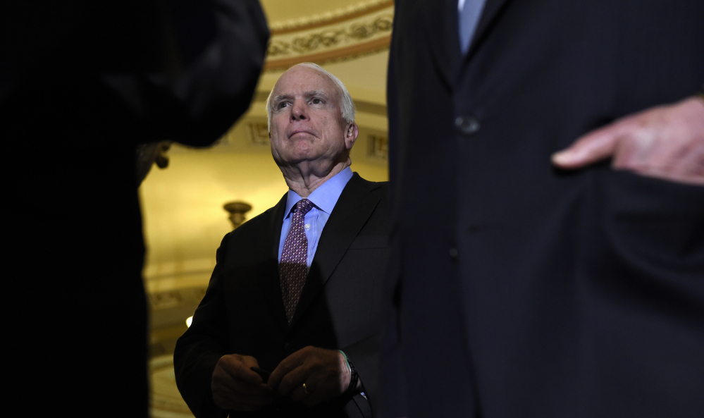 Senate Armed Services Committee Chairman John McCain, R-Ariz., listens during a news conference on Capitol Hill in Washington on Tuesday. The Senate passed a $612 billion defense policy bill Thursday.