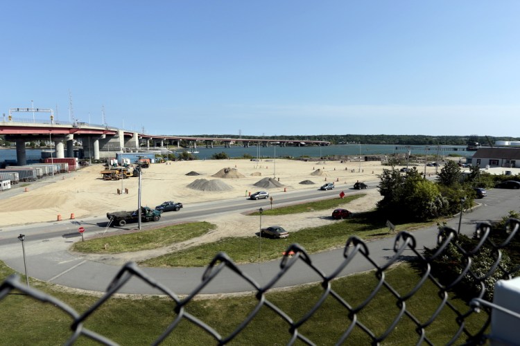Crews prepare this site on Commercial Street near the Casco Bay Bridge for an expansion of the International Marine Terminal. Plans call for the construction of an adjacent cold storage facility.