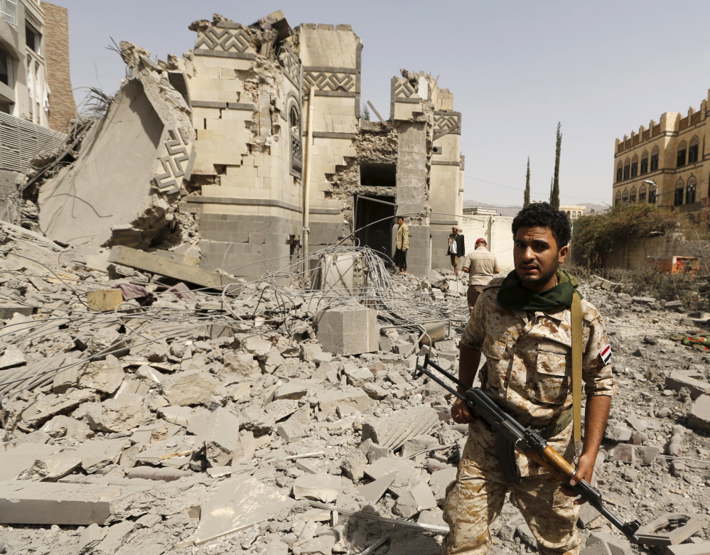 A Houthi militant stands in Sanaa, Yemen, on Sunday. Months of fighting helped create conditions leading to disease.