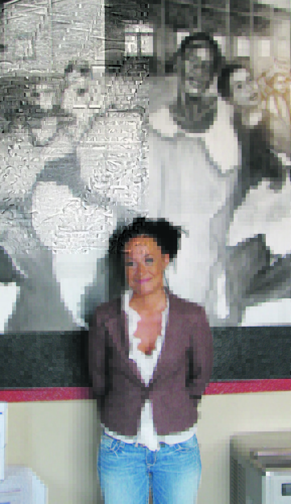 Rachel Dolezal in 2009, posing with a mural she painted at the Human Rights Education Institute in Coeur d’Alene, Idaho.