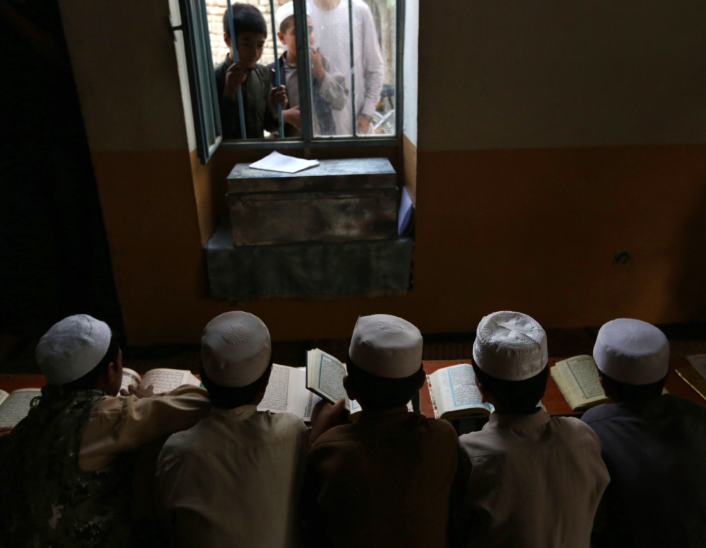 Afghan boys read the Quran during the Muslim holy month of Ramadan at a mosque in Kabul. 