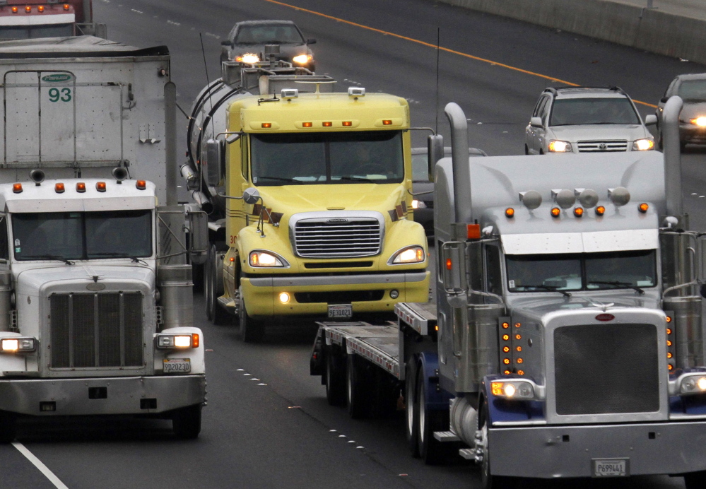 Tougher fuel-economy standards for heavy trucks and buses could reduce spending on gasoline and diesel by an estimated $170 billion, the Obama administration says.