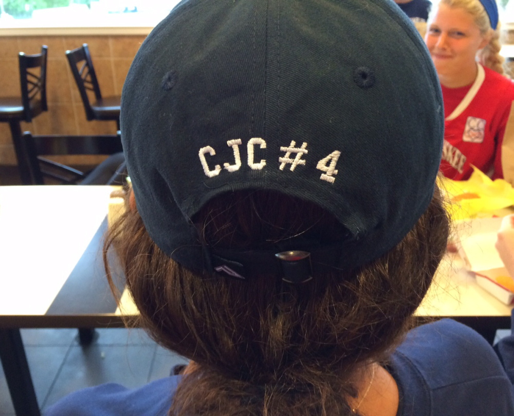 The Messalonskee girls lacrosse team had hats designed to honor teammate Cassidy Charette with her initials and jersey No. 4.