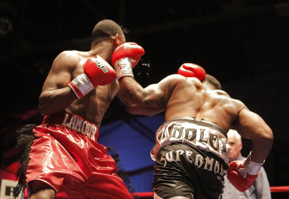 Derrick Findley of Chicago, right, lands a punch on Russell Lamour Jr. of Portland during their eight-round super middleweight bout Saturday night at the Portland Expo.