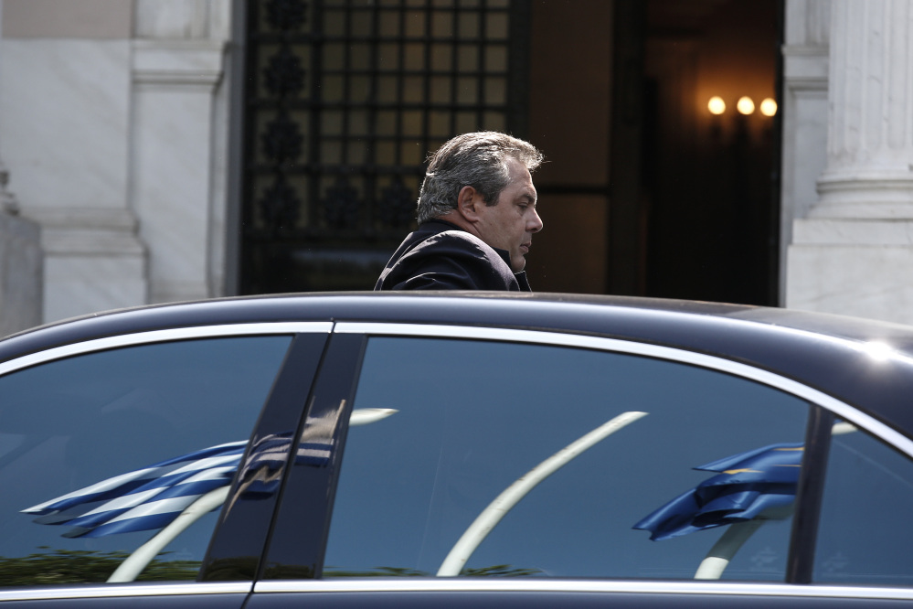 Greece’s Defense Minister Panos Kamenos arrives for a Cabinet meeting at the Greek prime minister’s office in Athens on Sunday.