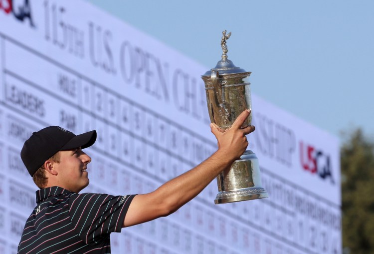  Jordan Spieth poses with the trophy after winning the U.S. Open on Sunday at Chambers Bay in University Place, Wash.