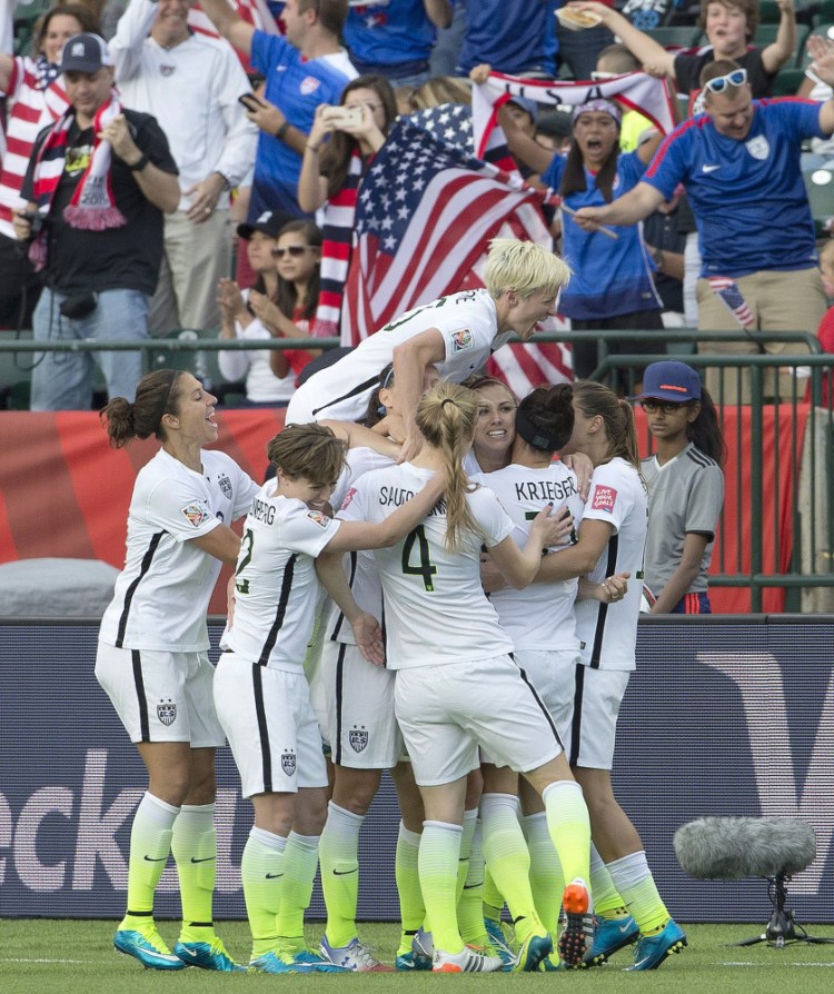 The U.S. team celebrates a goal against Colombia in the second half of Monday’s 2-0 win in the Women’s World Cup tournament.