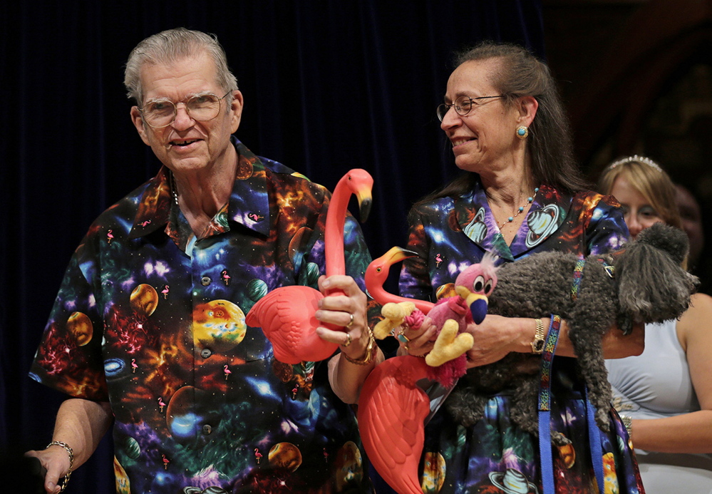 Don Featherstone, 1996 Ig Nobel Prize winner and creator of the plastic pink flamingo lawn ornament, poses with his wife, Nancy, in 2012, while being honored as a past recipient at the Ig Nobel Prize ceremony at Harvard University.