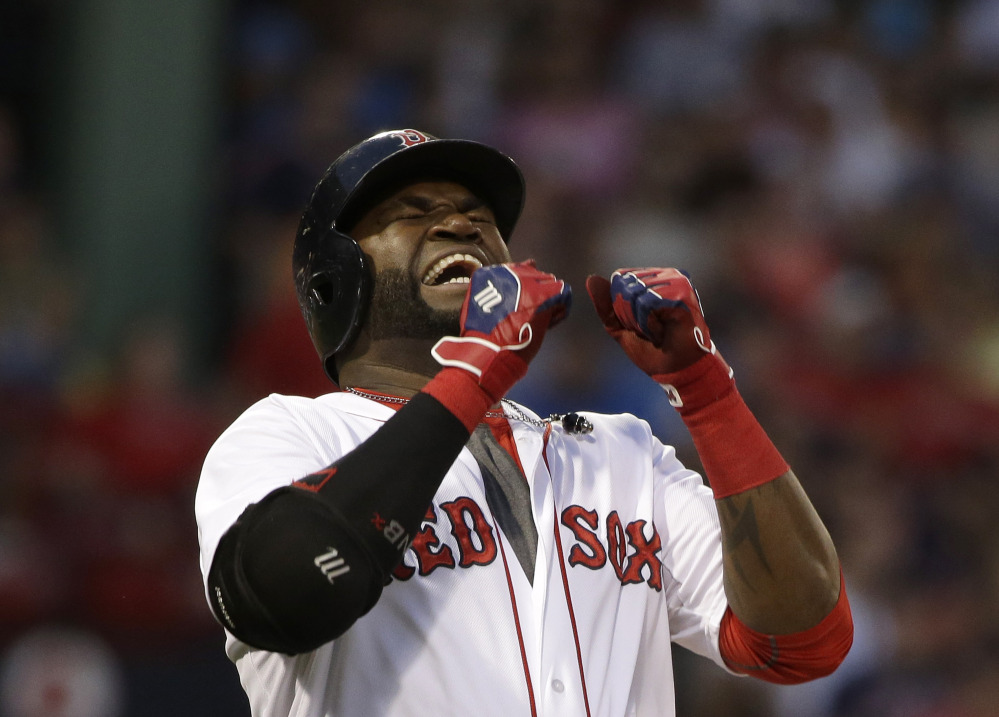 Red Sox designated hitter David Ortiz grimaces after flying out to center field to end the third inning of Tuesday night’s loss to the Orioles.