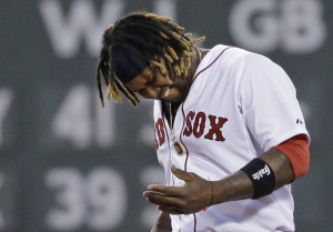 Boston’s Hanley Ramirez grimaces and looks at his left hand after getting hit on the base path by a ball hit by teammate Xander Bogaerts in the fifth inning. Ramirez left the game after getting hit. Second baseman Dustin Pedroia left one inning later with a hamstring injury.