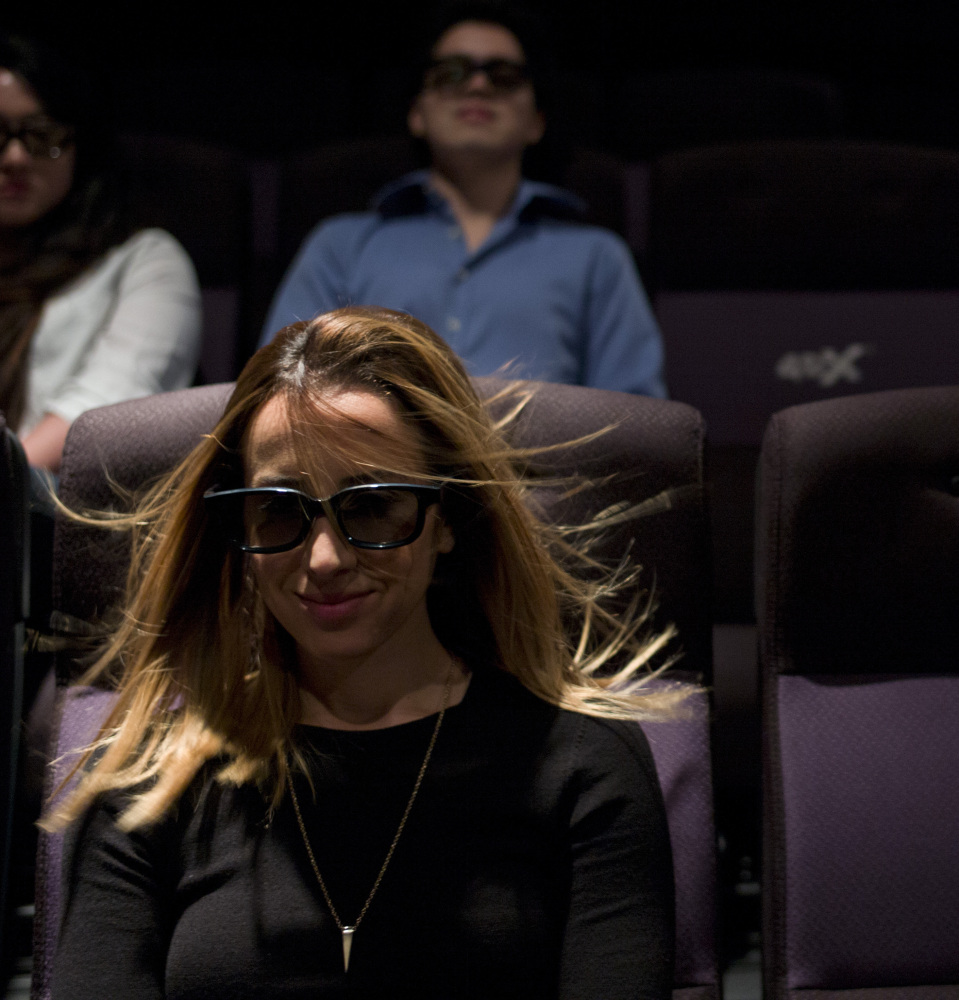 An in-theater wind effect ruffles marketing director Yassamine Wahab’s hair during a demonstration at the CJ Group’s 4DX Laboratory in Hollywood.