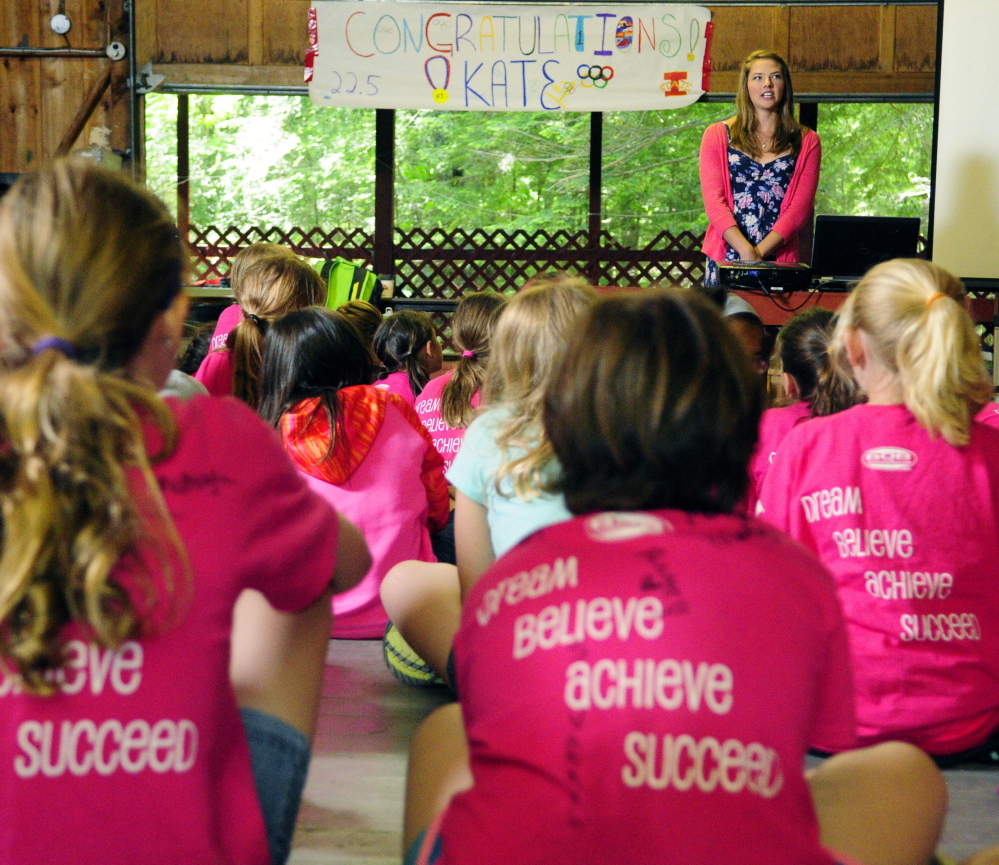 Campers listen raptly as Kate Hall speaks at Julia Clukey’s Camp for Girls on Thursday in Readfield. Hall recently set a national high school record and qualified for the U.S. Olympic team trials in the long jump.