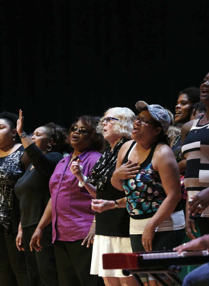Members of the Green Memorial AME Zion Church choir sing to honor the lives lost in the attack in Charleston.