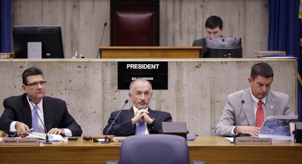 Boston City Council President Bill Linehan, center, listens to a presentation from Boston’s 2024 concerning their Olympics bid during a special council committee hearing at City Hall in Boston on Friday.