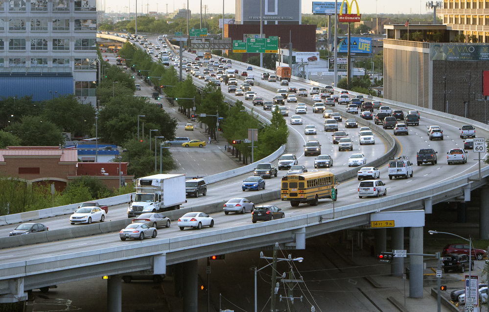 Traffic travels along a highway in Houston. While Houston plans improvements to the interstate, other cities and regions have been unwilling or unable to get ahead of a looming transportation crisis, experts say.