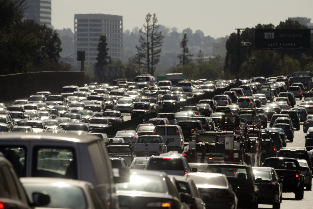 Traffic slowly moves along the 101 Freeway during afternoon rush hour in Los Angeles. Traffic congestion is projected to become significantly worse and more widespread without big changes in how people and products get around. The possible solutions are many, but none is easy or cheap.