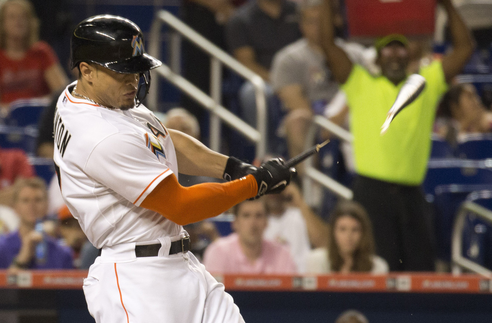 Miami’s Giancarlo Stanton broke his left hand swinging a bat Friday night against the Dodgers. He is expected to be out four to six weeks.