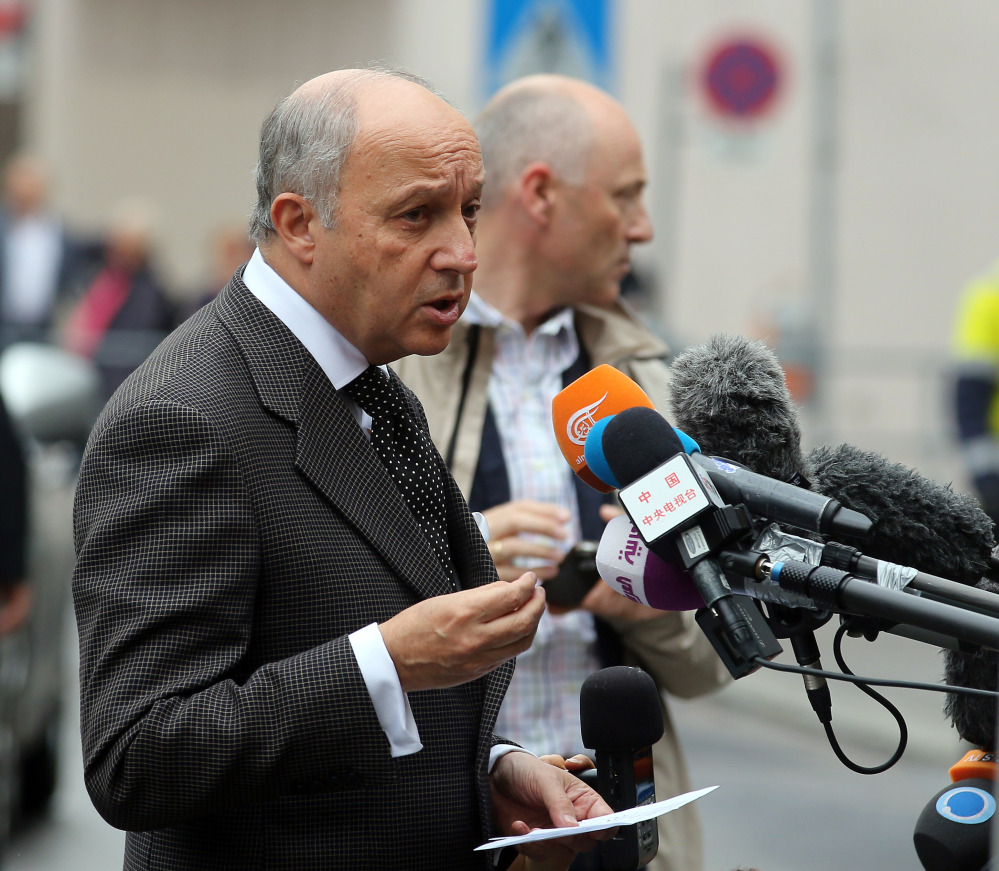 French Foreign Minister Laurent Fabius talks to media as he arrives at Palais Coburg where closed-door nuclear talks with Iran take place in Vienna, Austria, on Saturday.