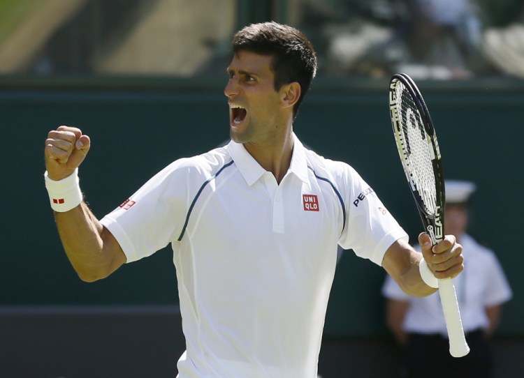 Novak Djokovic of Serbia celebrates defeating Philipp Kohlschreiber of Germany in their men’s singles first round match at the All England Lawn Tennis Championships in Wimbledon, London, Monday.