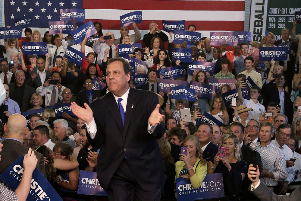 New Jersey Gov. Chris Christie greets supporters during an event announcing he will seek the Republican nomination for president on Tuesday at Livingston High School in Livingston, N.J.
