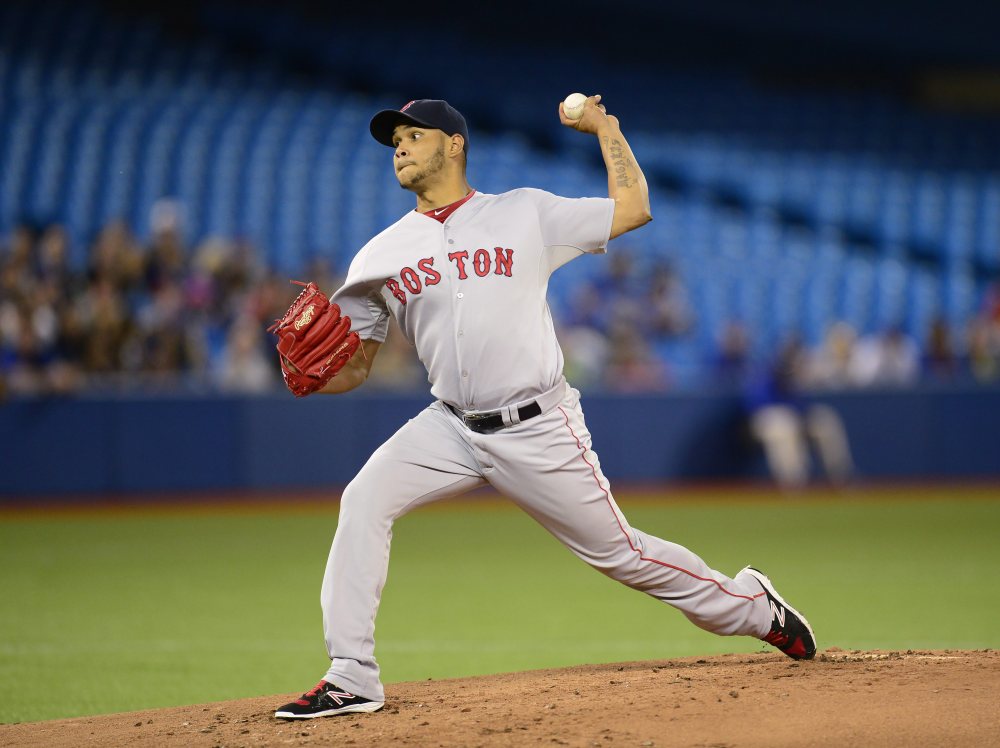 Red Sox starting pitcher Eduardo Rodriguez works against the Blue Jays in the first inning Tuesday night in Toronto. Rodriguez got his fourth win of the season, holding the potent Blue Jays to one run on four hits in six innings.