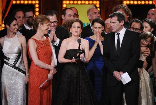 Kristin Caskey, center, along with cast and crew, accepts the award for best musical for "Fun Home" at the 69th annual Tony Awards at Radio City Music Hall on Sunday. The Associated Press