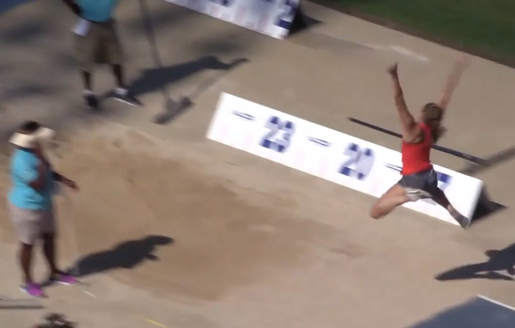 In this image taken from video, Kate Hall makes her record-setting long jump Sunday at the New Balance Nationals in Greensboro, N.C. 