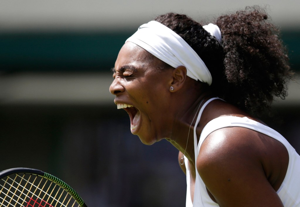 Serena Williams celebrates a point during the women's singles first round match against Margarita Gasparyan of Russia in Wimbledon, London, on Monday. On Tuesday, Serena and her sister, Venus, pulled out of the doubles match.