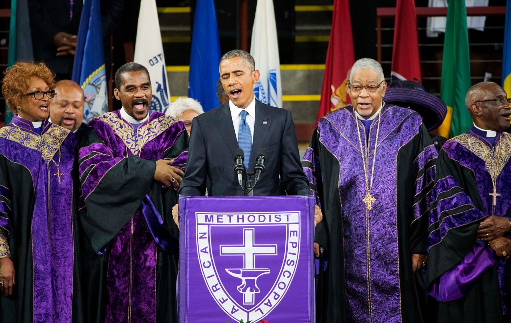 President Barack Obama leads the congregation in singing "Amazing Grace" during services honoring the life of Rev. Clementa Pinckney on Friday at the College of Charleston TD Arena in Charleston, S.C.