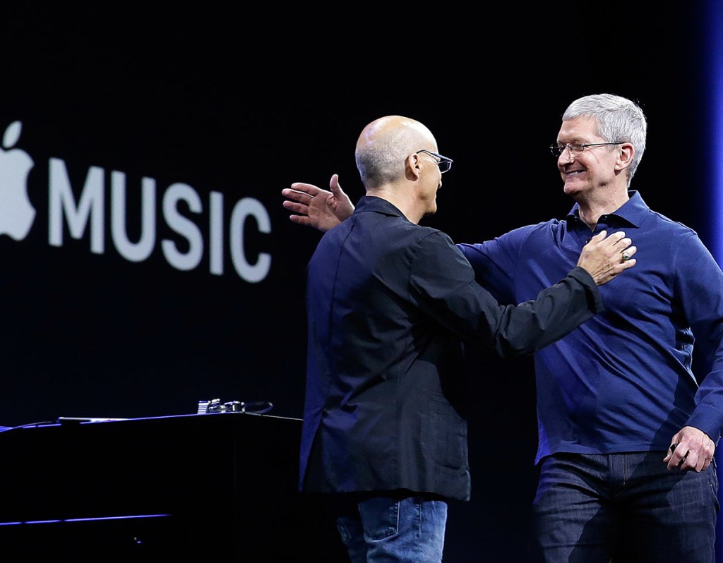 Apple CEO Tim Cook, right, hugs Beats by Dre co-founder and Apple employee Jimmy Iovine at the Apple Worldwide Developers Conference in San Francisco on Monday. Apple Music, a new, paid music streaming service will launch this month. 