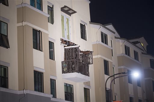 A fourth-floor balcony rests on the balcony below after collapsing at the Library Gardens apartment complex in Berkeley, Calif., early Tuesday. The Associated Press