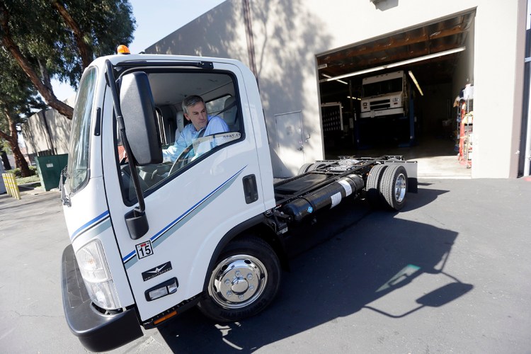 Wrightspeed CEO Ian Wright drives an electric-powered truck at the company's headquarters in San Jose, California. Wrightspeed,makes electric powertrains that can be installed on commercial trucks, making them more energy-efficient. The Associated Press