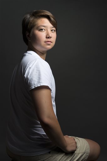 "Through high school I grew my hair out, I conformed, I dressed in the high heels to prom – and I was miserable," Schuyler Bailar says. "I did succeed in swimming because that was really my only outlet." 
Marvin Joseph/The Washington Post via AP