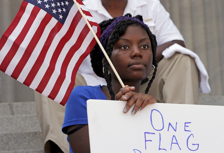 Asha Jones listens to the speakers during a rally outside the State House in Columbia, South Carolina, Tuesday. Reuters