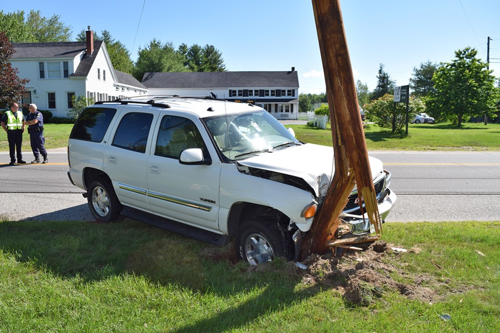 This GMC Yukon was forced off the road during the collision, but its driver escaped injury.. Gorham Police Department photo