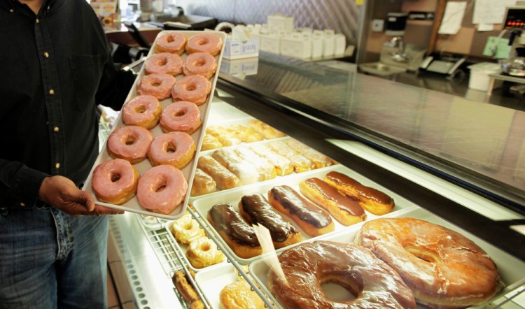 Doughnuts (these are in Chicago) and other commercial baked goods are likely to contain trans fats. There are a lot fewer trans fats in the nation's food than there were a decade ago, but the Obama administration is moving toward getting rid of them almost entirely. The Food and Drug Administration says Americans still eat about a gram of trans fat every day, and phasing it out could prevent 20,000 heart attacks and 7,000 deaths each year.