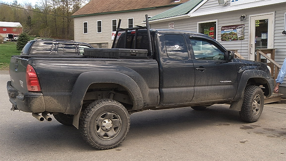 Robert Burton is believed to be driving this black Toyota Tacoma pickup truck with Maine wildlife license plate 489-AKJ.  Image courtesy of WABI-TV via Maine Department of Public Safety